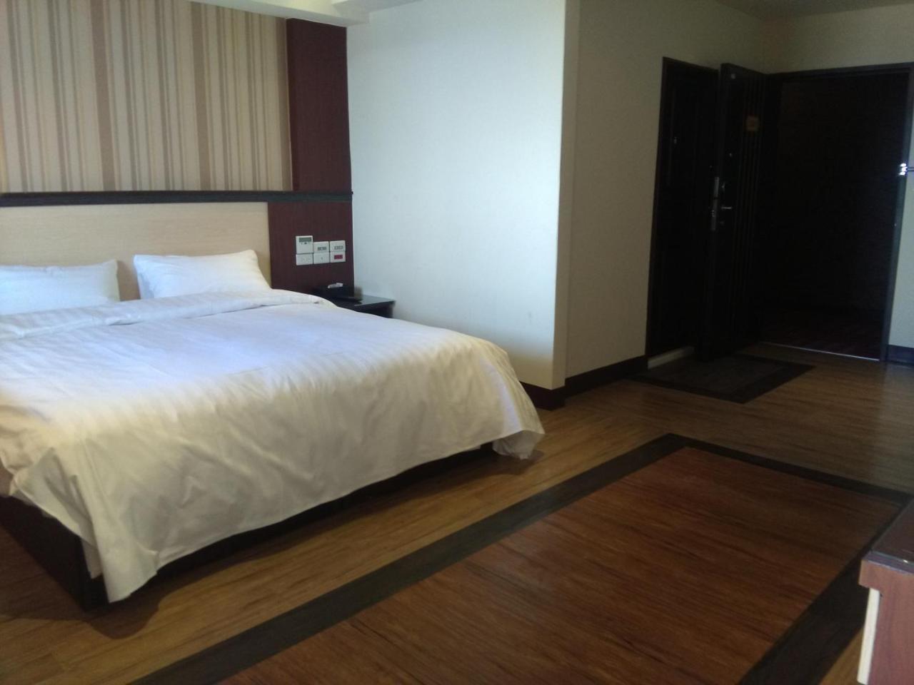 Dengfeng Milan Business Hotel Huwei Extérieur photo